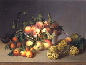 Bunches of peaches, nectarines, and grapes surround a bowl of peaches.